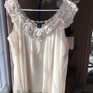 Sleeveless, knitted and flowy.